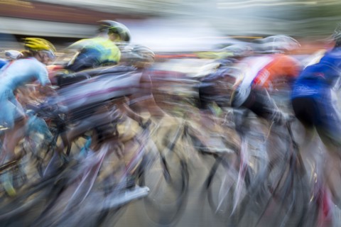 Blurred view of cyclists competing in race