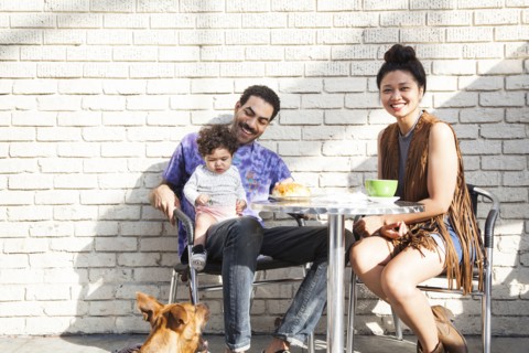 Parents eating with baby son at outdoor cafe