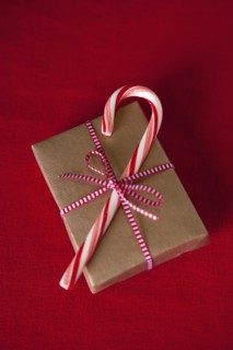 Candy can on top of Christmas gift