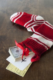 Christmas stocking with airline tickets and cash