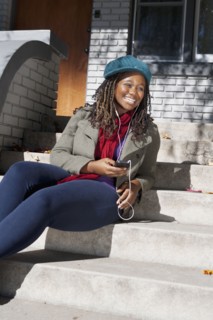 Black woman listening to music on mp3 player