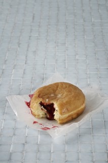 Jelly donut on bathroom floor