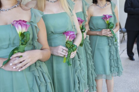 Bridesmaids holding bouquets of flowers