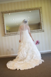 Lebanese bride admiring herself in mirror