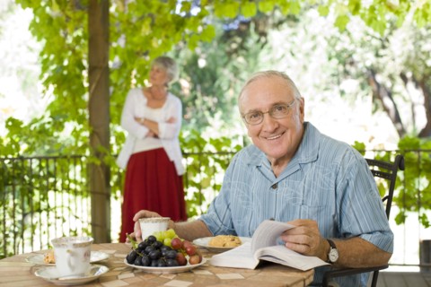 Man having breakfast outdoors