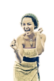 Portrait of enthusiastic woman wearing owl necklace