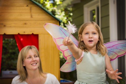 Mother and daughter in playhouse