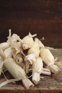 Stack of wrapped corn tamales