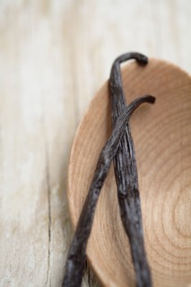 Close up of Mexican vanilla beans on wooden spoon