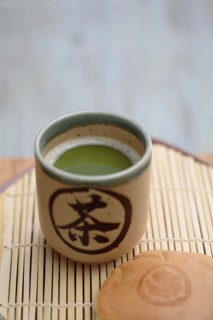 Close up of Japanese green Matcha tea and red bean pastry