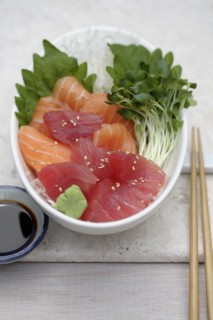 Close up of sashimi and sprouts