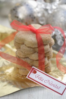 Christmas cookies tied with red ribbon