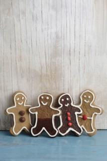 Four gingerbread man cookies in a row
