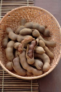 Tamarind pods in wicker basket