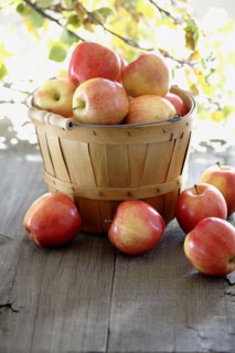 Red apples overflowing basked