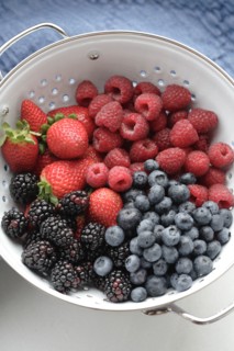 Various fresh berries in colander