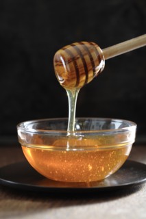 Honey dripping off of dipper