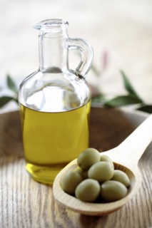 Olives and olive oil in jug