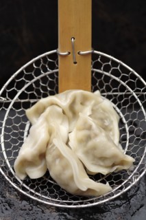 Asian dumplings in strainer