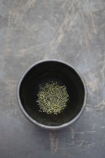 Dried sencha tea in tea cup