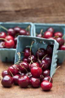 Close up of bing cherries in cartons