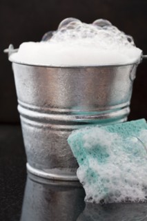 Bucket of soap suds and sponge