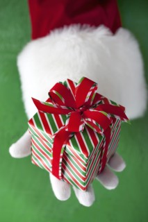 Santa Claus holding Christmas gift
