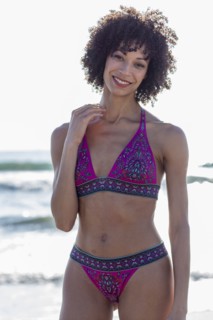 Mixed Race woman wearing bikini near ocean