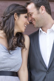 Smiling couple touching foreheads