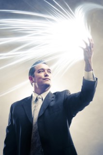 Light radiating from Japanese businessman's hands