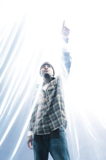 African American man pointing at light spark