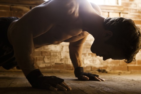 Caucasian man doing push-ups