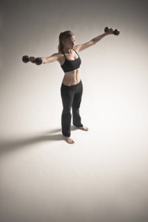 Caucasian woman exercising with dumbbells
