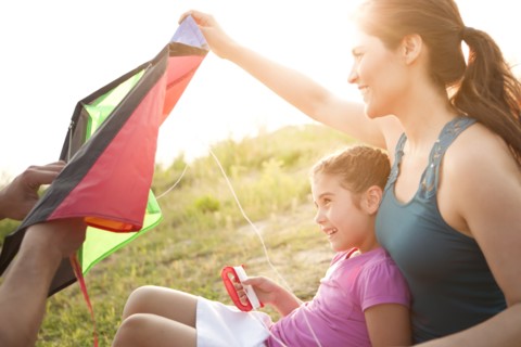 Family preparing to fly kite