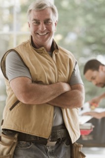 Caucasian carpenter standing with arms crossed