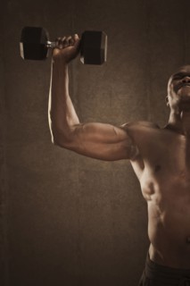 African American man lifting weights