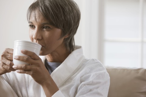 Native American woman drinking coffee