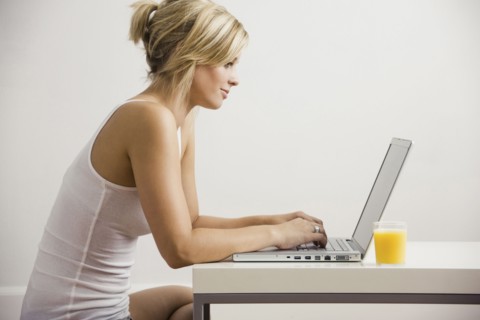 Caucasian woman using laptop