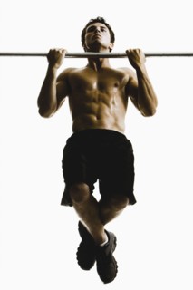 Caucasian man doing pull-ups