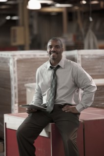 Black businessman working in warehouse