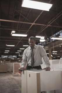 Black businessman working in warehouse