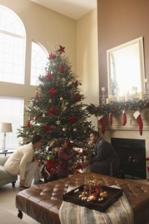 Family opening gifts Christmas morning