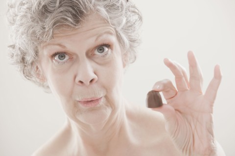 Caucasian woman holding chocolate