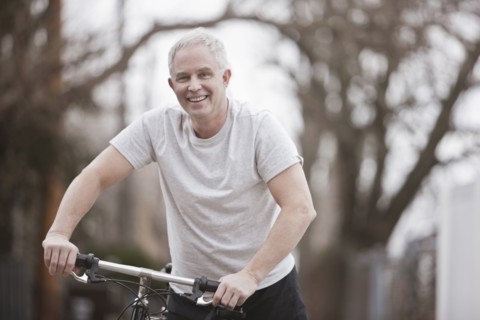 Caucasian man riding bike