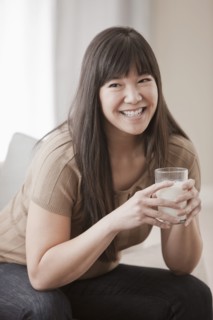 Asian woman drinking milk