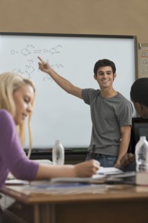 Student explaining formula in classroom