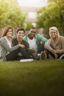 Students sitting together on grass
