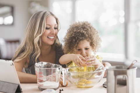 Mother and daughter baking together