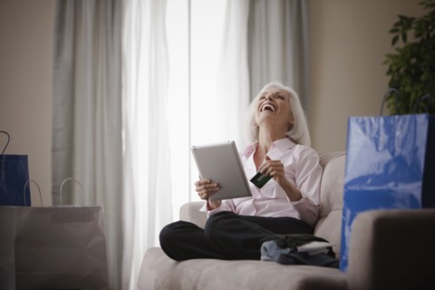 Caucasian woman shopping online with credit card
