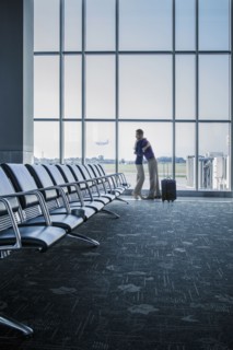 Caucasian couple hugging in airport